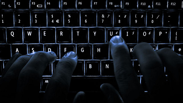 man typing on keyboard 