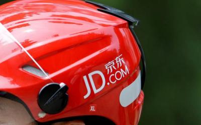 FILE PHOTO: Logo of JD.com is seen on a helmet of a delivery man in Beijing