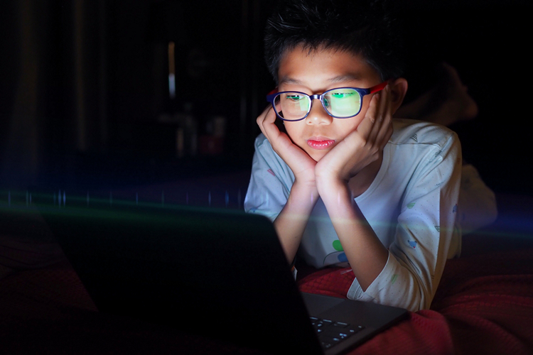 teen using laptop