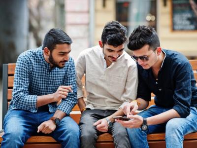 Indian-youth-using-smartphones-shutterstock-website