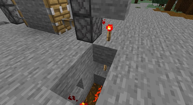Placing Redstone Torches in Minecraft Redstone Door
