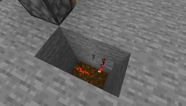 Red stone torch in a hole