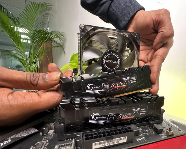 RAM being installed on ASUS ROG motherboard