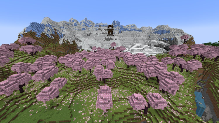 Pillager outpost naturally generated on top of a snowy mountain overlooking a cherry grove biome