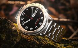Fire-Boltt Dagger Luxe smartwatch placed on a rock with a brown background