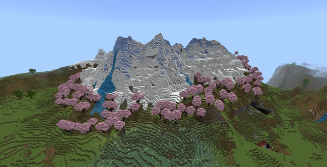Snowy mountain covered with ice and surrounded by a ring of cherry blossom trees