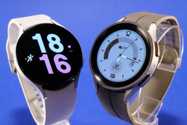 Samsung Galaxy Watch 5 showcased with a blue background in a white and gray color options