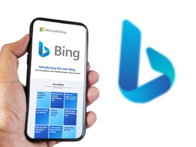 This image depicts the Microsoft Bing chatbot in a smartphone with the Bing logo in the background