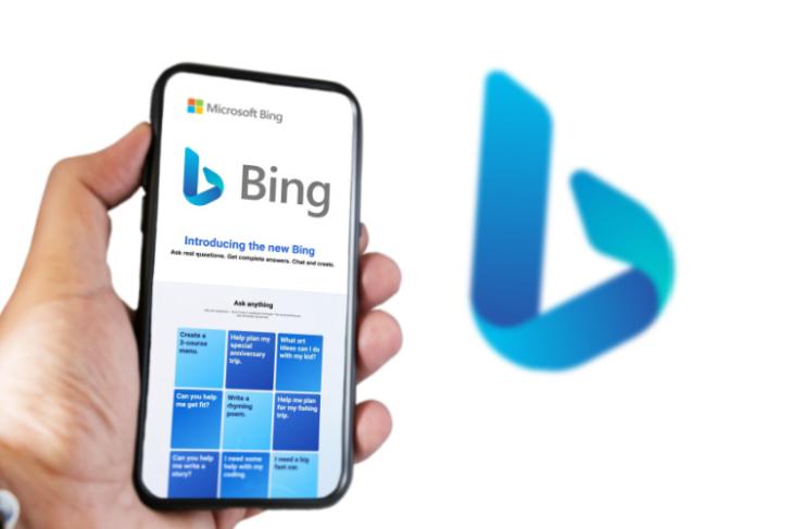 This image depicts the Microsoft Bing chatbot in a smartphone with the Bing logo in the background