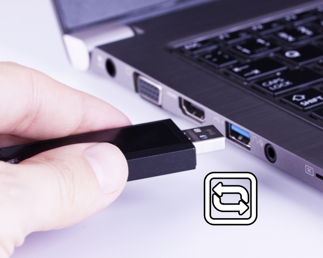 A USB Device being unplugged from a laptop 