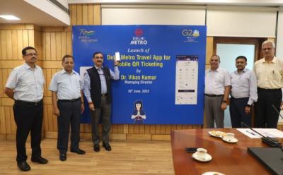 This picture represents the launch of the DMRC Metro Travel App