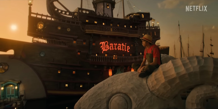 Luffy sitting in top of Going Merry infront of the Baratie Restaurant.