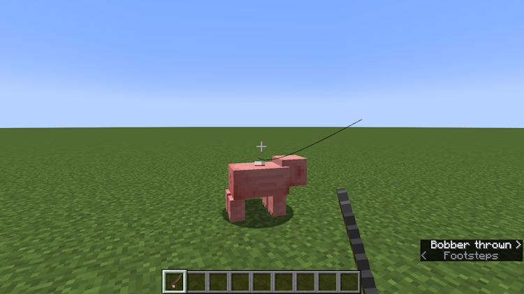 Enganchando um porco com uma vara de pescar no Minecraft