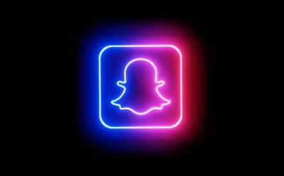 The Snapchat logo placed on a black background and is represented with blue and pink neon colors