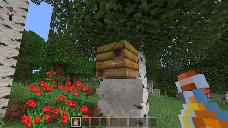 Player holding a honey bottle that just collected from a bee nest in Minecraft