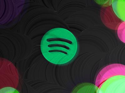 This image depicts the Spotify logo placed in a black background with colored corners
