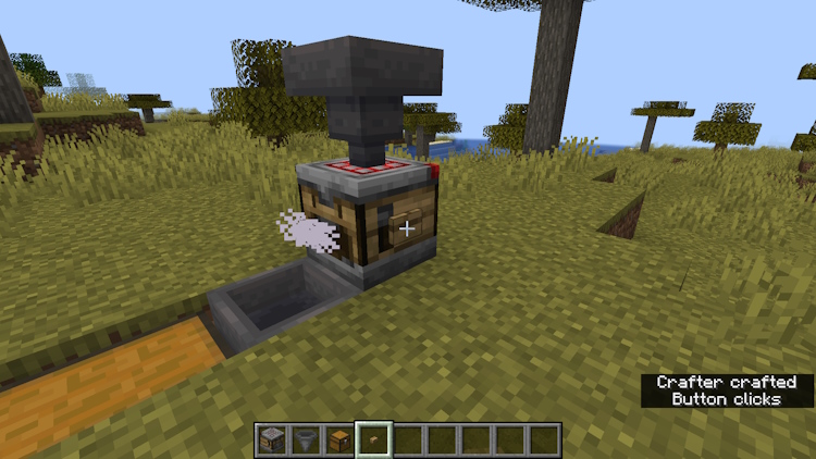 Place a button on the Minecraft crafter and activate it