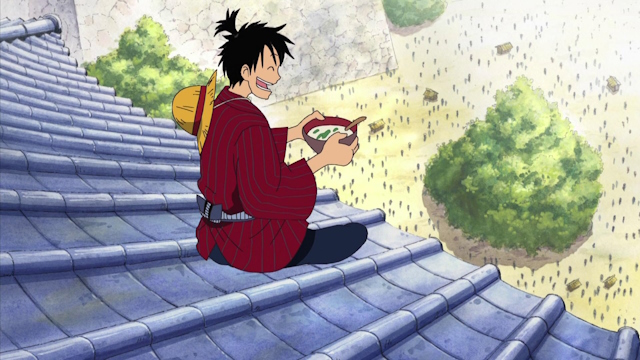 Luffy in traditional Japanese outfit and eating.