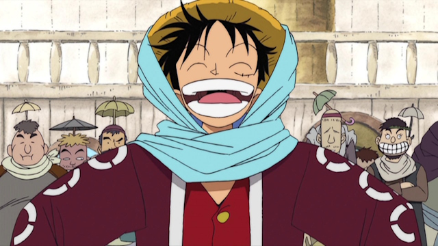 An image of Luffy smiling in his Arabasta outfit.