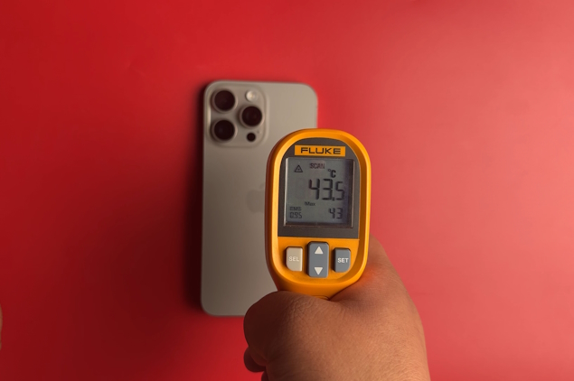 using a thermal gun to measure iPhone 15 Pro Max temperature
