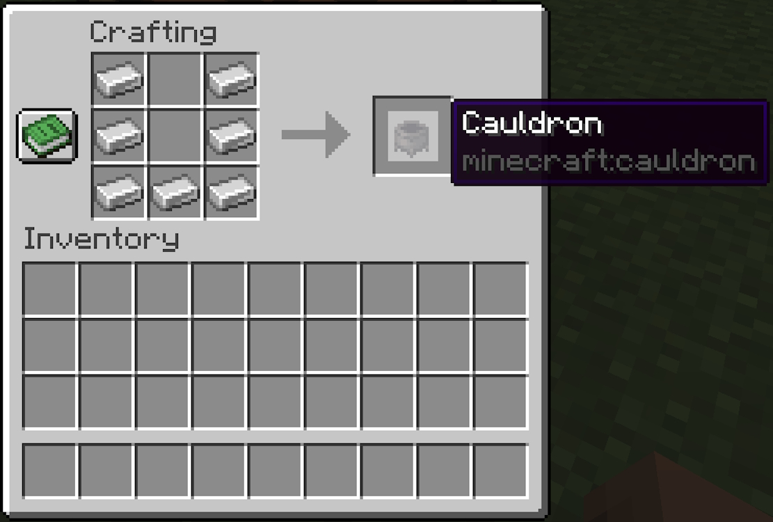 Crafting table's grid with iron ingots filling the bottom row and left and right columns which makes for the completed crafting recipe of the cauldron in Minecraft