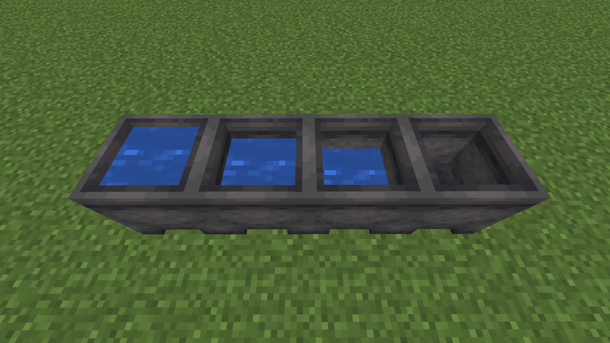 Four cauldrons filled with different water levels in Minecraft