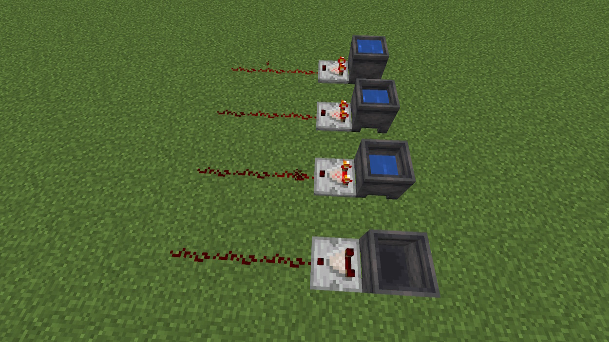 Four cauldrons with different water levels inside and comparators outputting the redstone signal