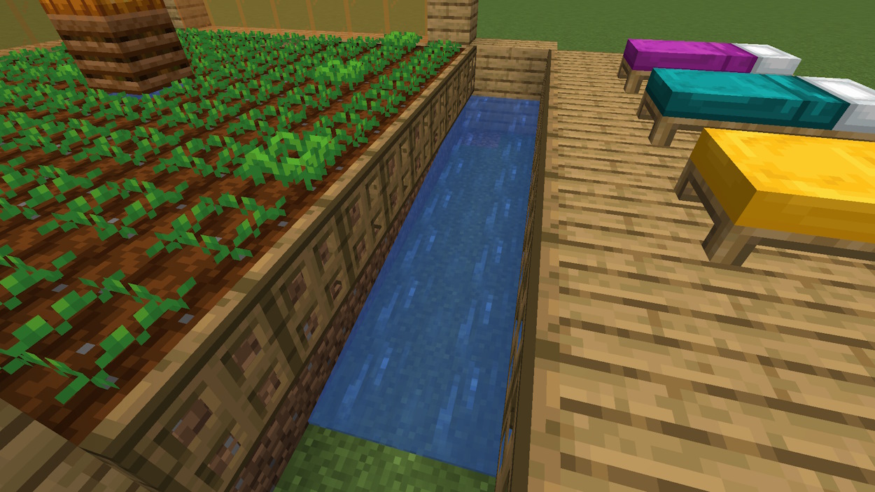 Below the trapdoors there is a hole that has water sources on one end so it pushes villagers to the side