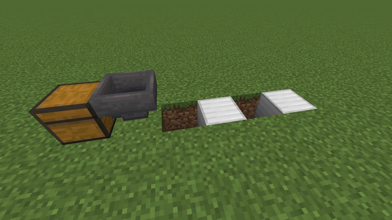 Two solid blocks placed in a hole behind the hopper
