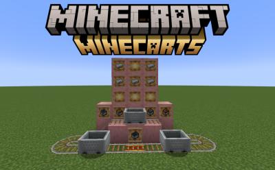 Connected rails and powered rails with several minecarts on top and solid blocks with item frames holding iron ingots and minecart variants in Minecraft