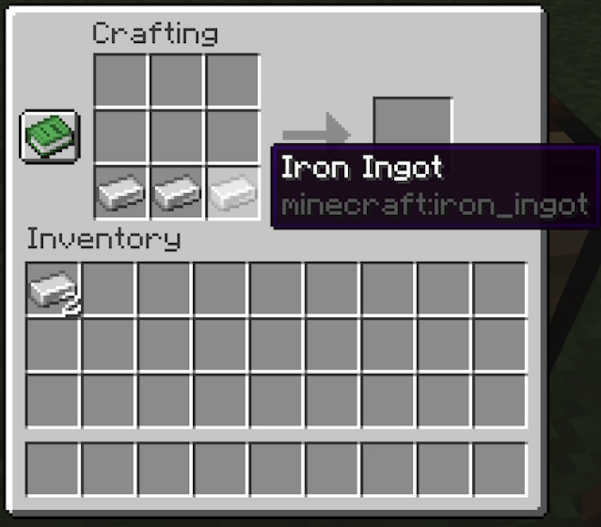 Three iron ingots placed in the bottom row of the crafting grid