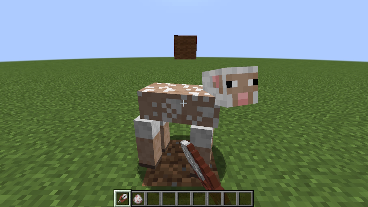 Shearing a sheep with shears in Minecraft