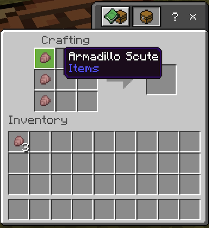 Three armadillo scutes placed in the left column of the crafting grid