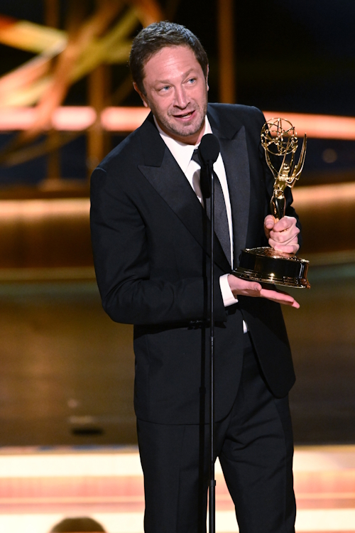 Ebon Moss-Bachrach with his emmy award