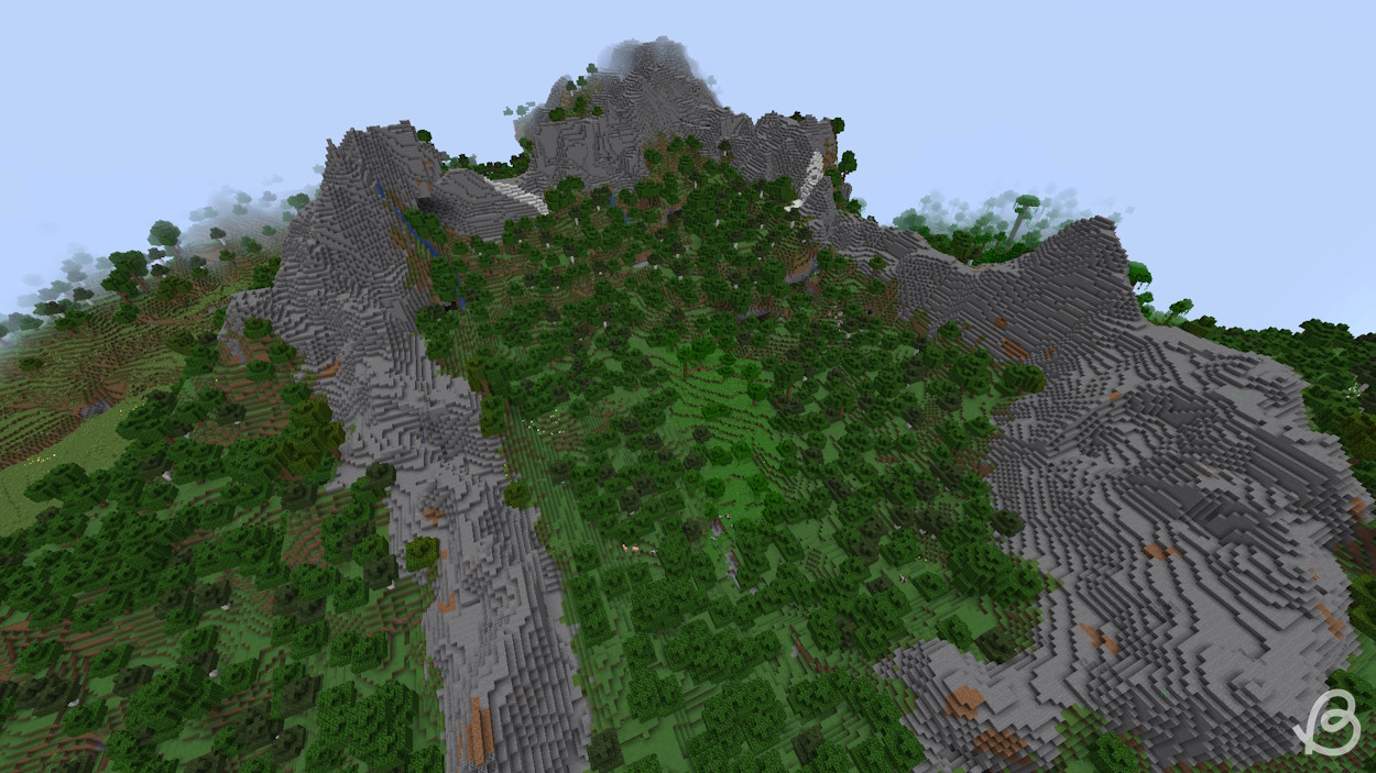 Graine de construction Minecraft avec un biome de pics pierreux entourant une forêt
