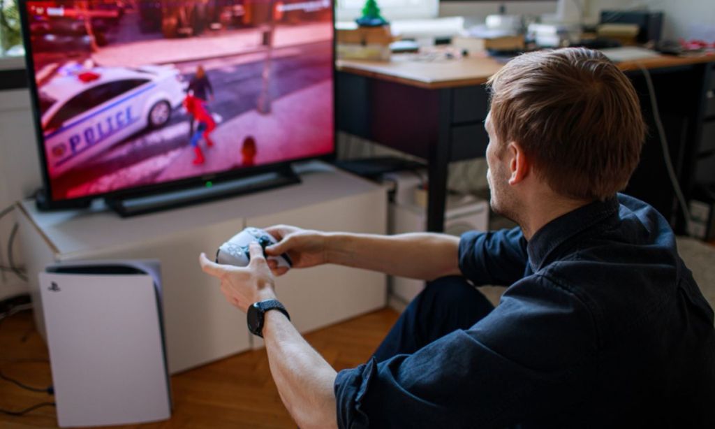 Man playing on PS5
