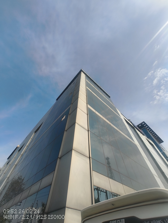 Nothing Phone 2a shot of a glass building captured through the ultra-wide-angle sensor