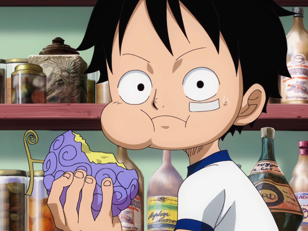 Luffy eatingGomu Gomu no Mi devil fruit.