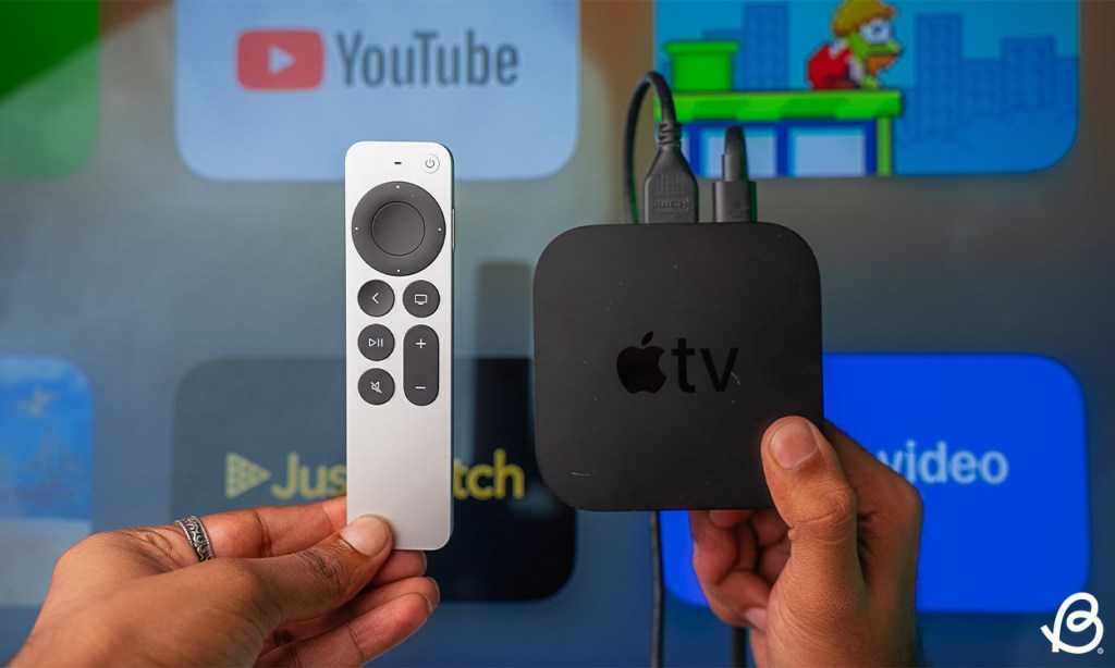 Apple TV and remote held close