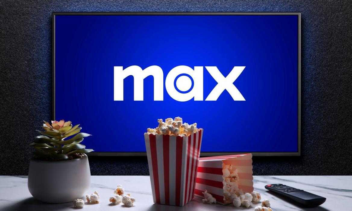 Max app welcome screen on a TV with tubs of popcorn in front