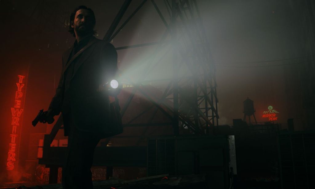 Alan Wake with a torch in his hand | Black Friday Playstation deals