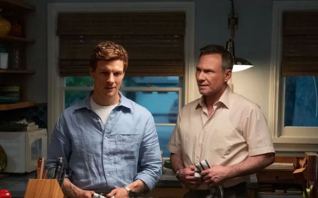 Patrick Gibson and Christian Slater standing near a table in Dexter Original Sin