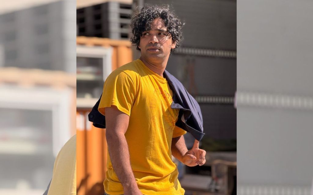 Tripathi Anupam wearing a yellow T-Shirt posing for a shot