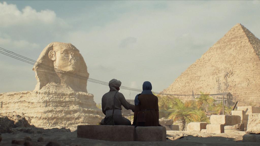 Indy and Gina sitting in front of the Great Sphinx and Pyramid