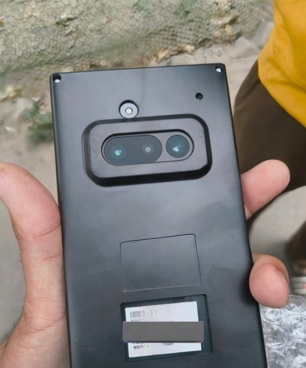 hand reportedly holding a Nothing Phone (3a) highlighting the rear design