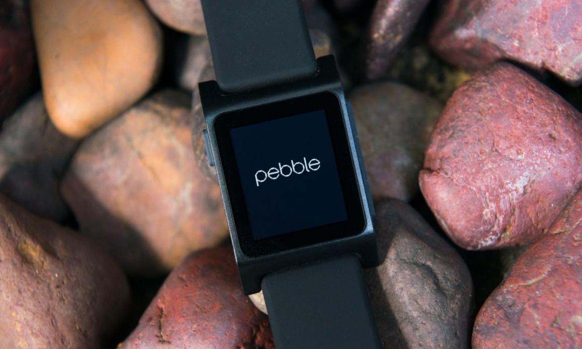 photo of a Pebble smartwatch placed on top of pebbles