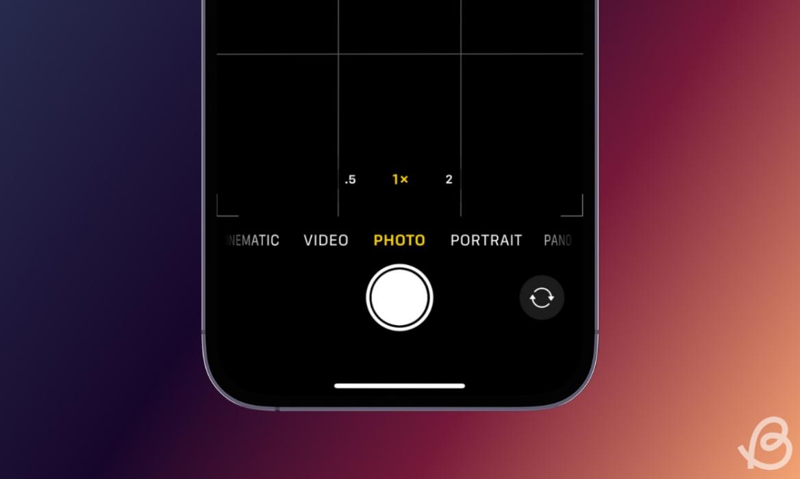 phone featuring iOS camera bottom interface in front of a gradient purple pink background