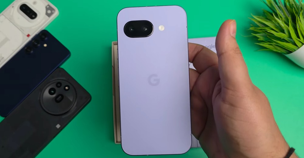 Pixel 9a in Iris Purple Color beside nothing phones