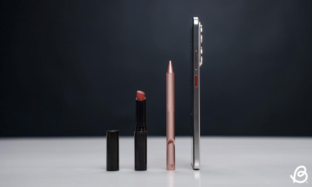 Realme P3 Ultra next to a pen and a lipstick